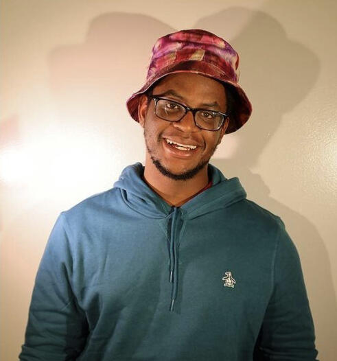 headshot of Dzidzor smiling